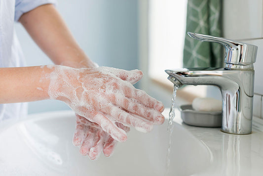View of someone washing hands. 